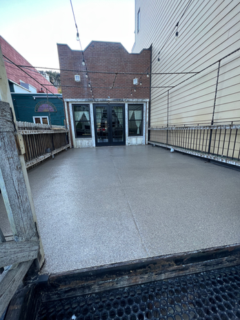 coated outdoor restaurant deck in Park City Utah with durable slip-resistant finish and mountain setting