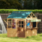 Two young children smiling inside a wooden outdoor playhouse on a grassy lawn with social skills callout icons.