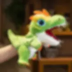 A person's hand wearing a cute green T-Rex dinosaur plush hand puppet, showing its mouth wide open with soft white teeth.