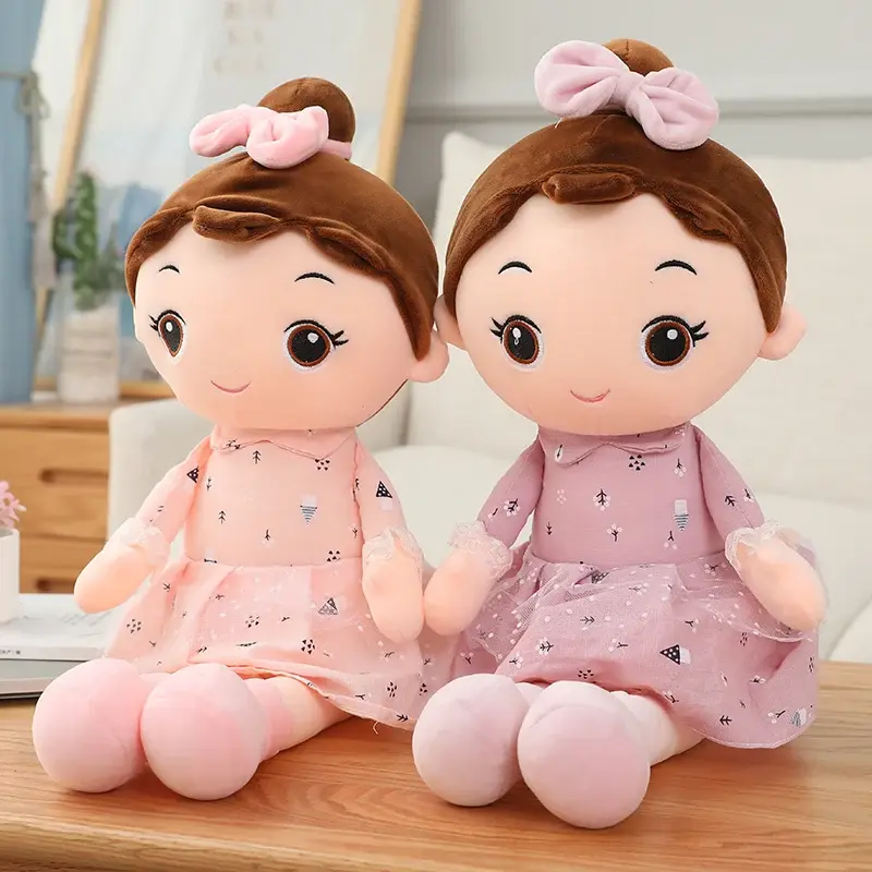 Two lovely soft rag dolls wearing beautiful pink dresses with lace details and hair bows.