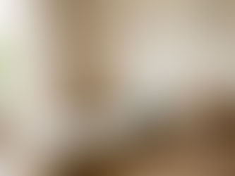 Close-up of low wooden shelves with Montessori toys in a toddler's bedroom