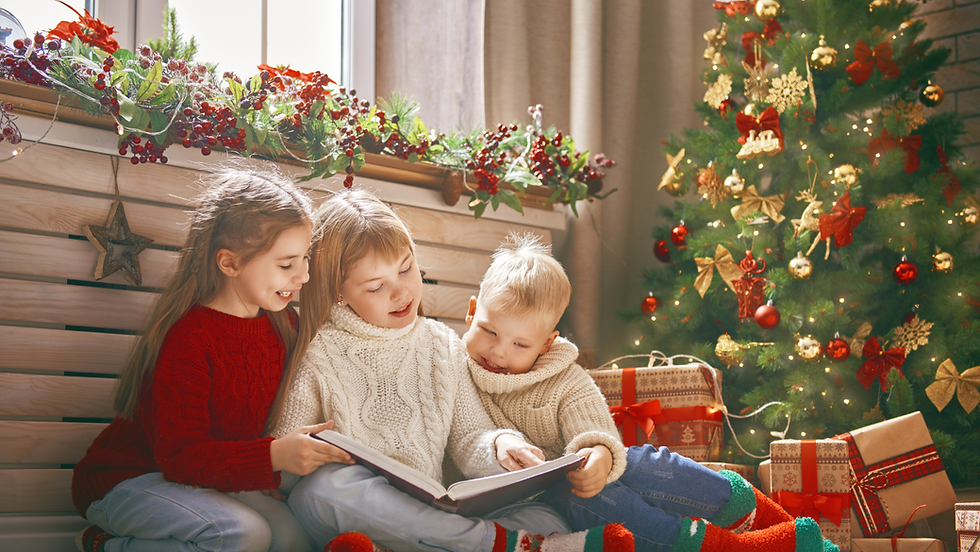 Children reading Christmas book