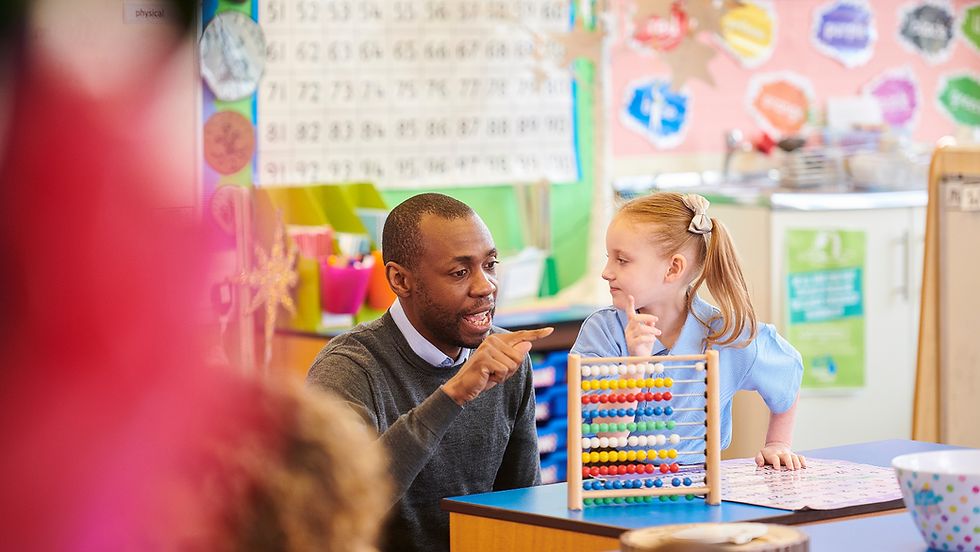 Primary Maths teacher and pupil