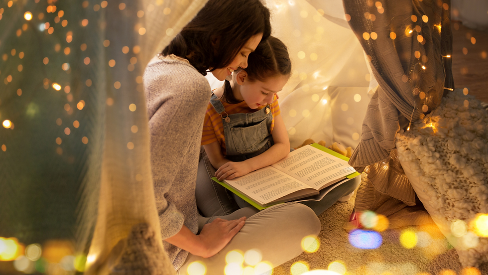 Mother reading to her daughter