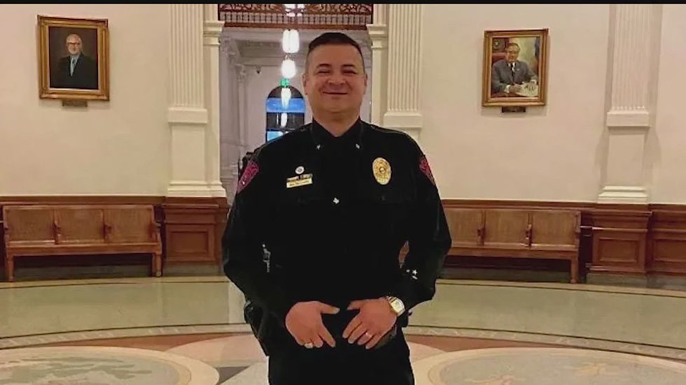 Portrait photo of Chief Homer Delgado in a formal building interior