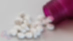 Valoid anti-nausea tablets spilling from a purple bottle, Mums & Bums Mother and Baby Clinic logo.