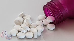 Valoid anti-nausea tablets spilling from a purple bottle, Mums & Bums Mother and Baby Clinic logo.