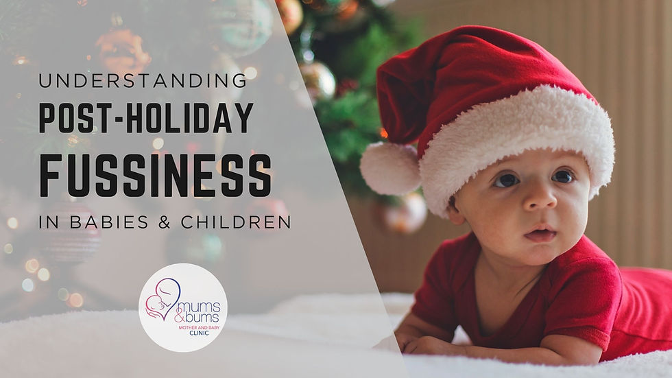 Baby wearing a Santa hat lying on a blanket, illustrating post-holiday fussiness in babies and children.