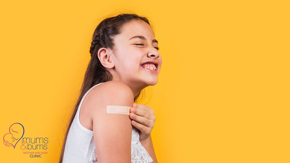Young girl smiling with plaster on arm after vaccination | Mums & Bums Clinic, Centurion.