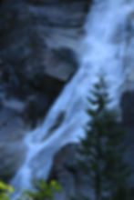 water roaring down Shannon Falls off of the sea to sky highway