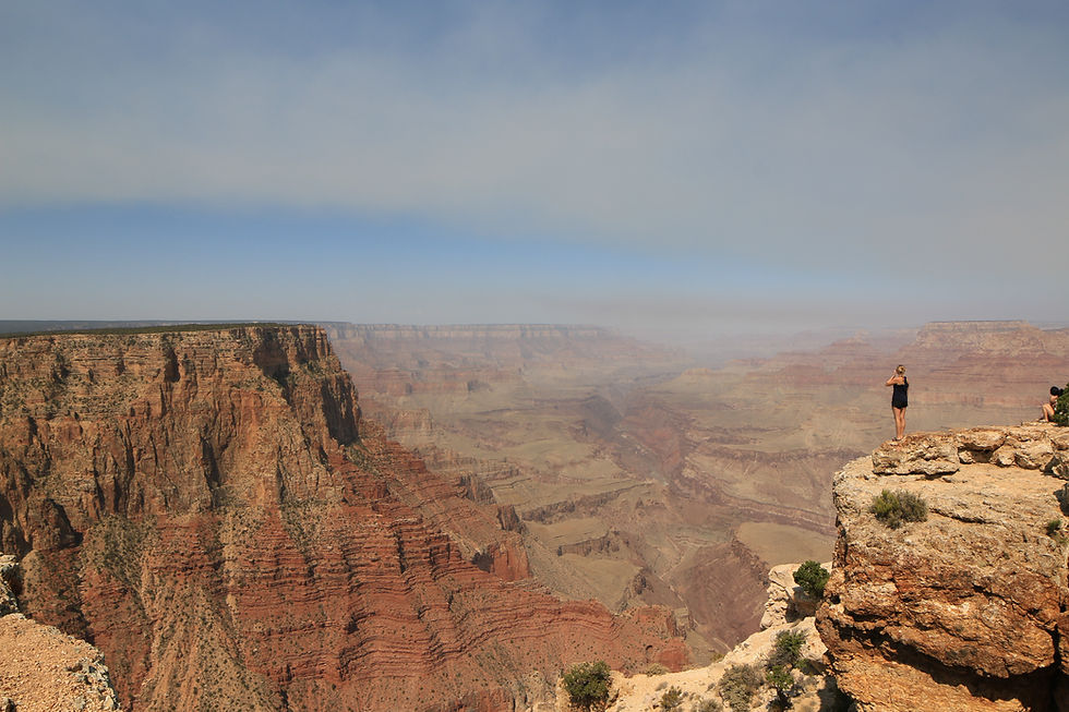 A girl looking over the grand canyon