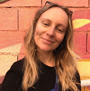 Edinburgh CBT therapist - a woman smilling with an orange and yellow background