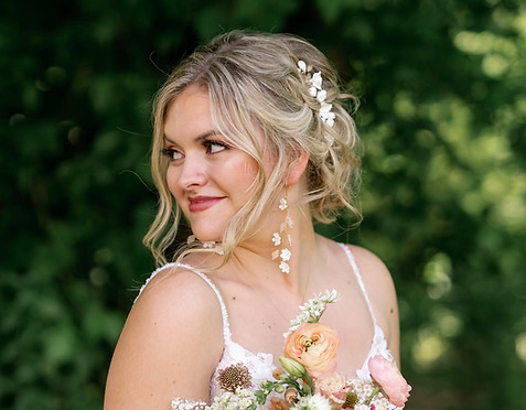 Bride with romantic bridal up-do, styled by HT Salon’s wedding specialists