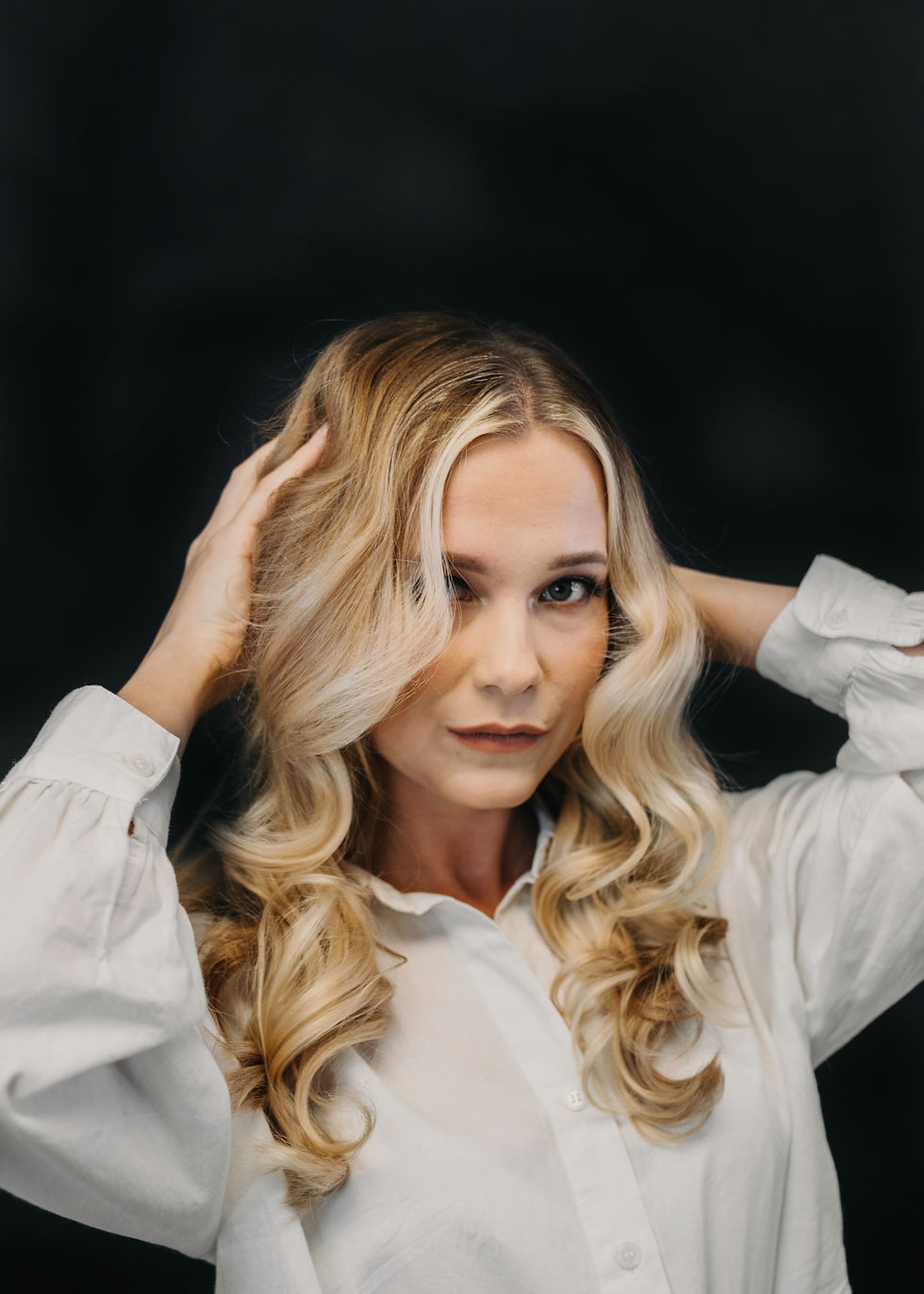 Close-up view of balayage hair highlights on long brown hair