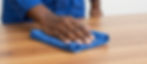Hand cleaning wooden surface, commercial cleaning services.