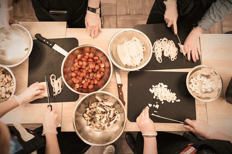 Close-up view of a parent and child preparing a healthy meal together