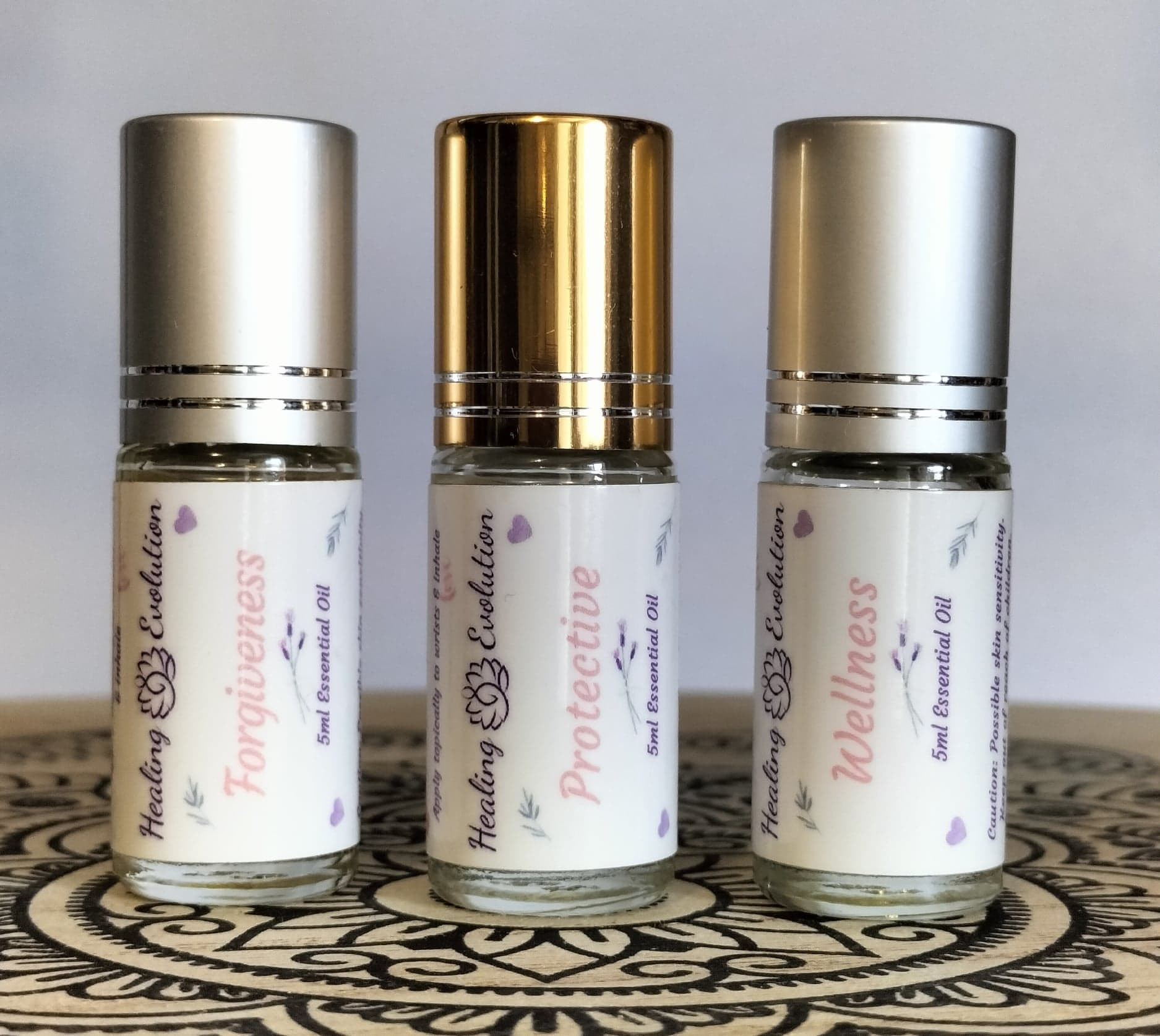 Trish Nash Aromatherapist Wellness emotional healing essential oils bundle with three essential oil bottles