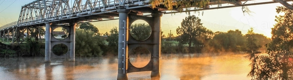 Morpeth bridge over foggy river