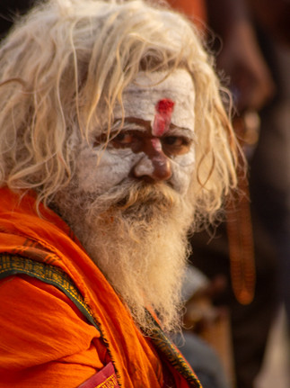 A man covered in powder looks at the camera