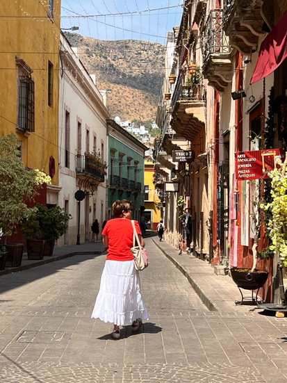 A woman walks through Guanajuato City