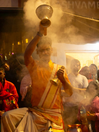 A priest prays at sunrise aarti