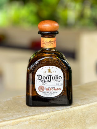 Don Julio Reposado tequila bottle featured at ROSA's Mexican Kitchen in Zanzibar, offering premium Mexican spirits and authentic cuisine.