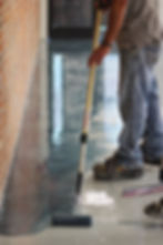 Xtreme field technician applying epoxy flooring in commercial space