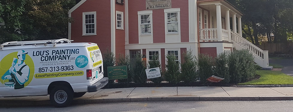 Lou's van with red house in the background