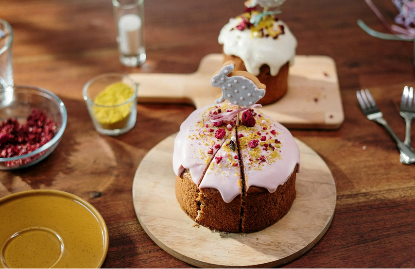 A fruit cake with white frosting
