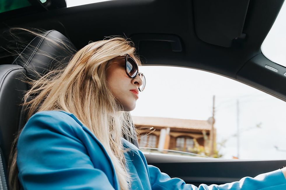 A woman wears sunglasses to protect her eyes.