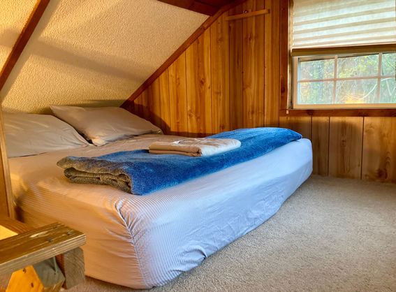 Full size bed in Loft 1