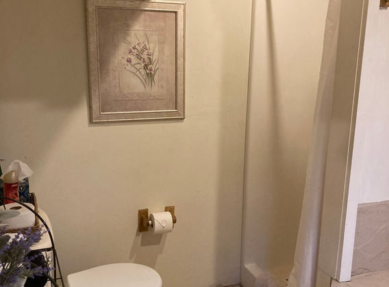 One person shower with curtain.