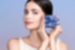 A model holding a beautifully wrapped gift box with Mount Tisé ribbons, showcasing elegance and style.