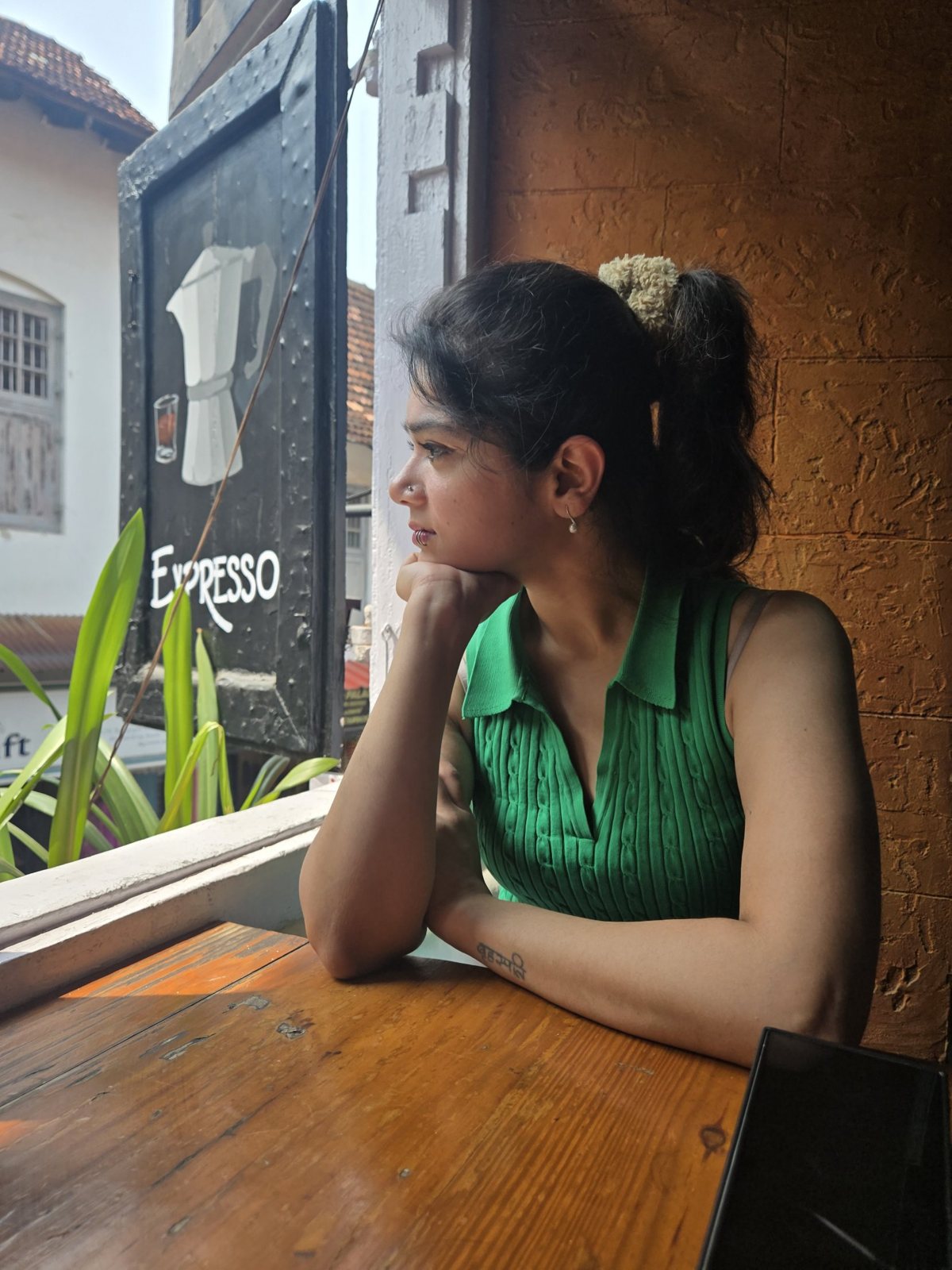 Mithila Malaviya at a café window