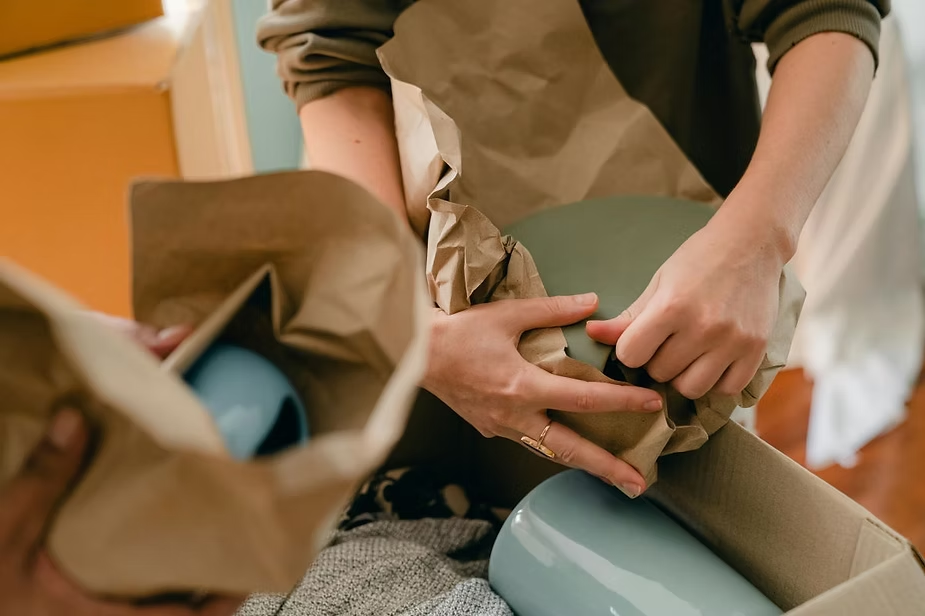 People packing their items for a move
