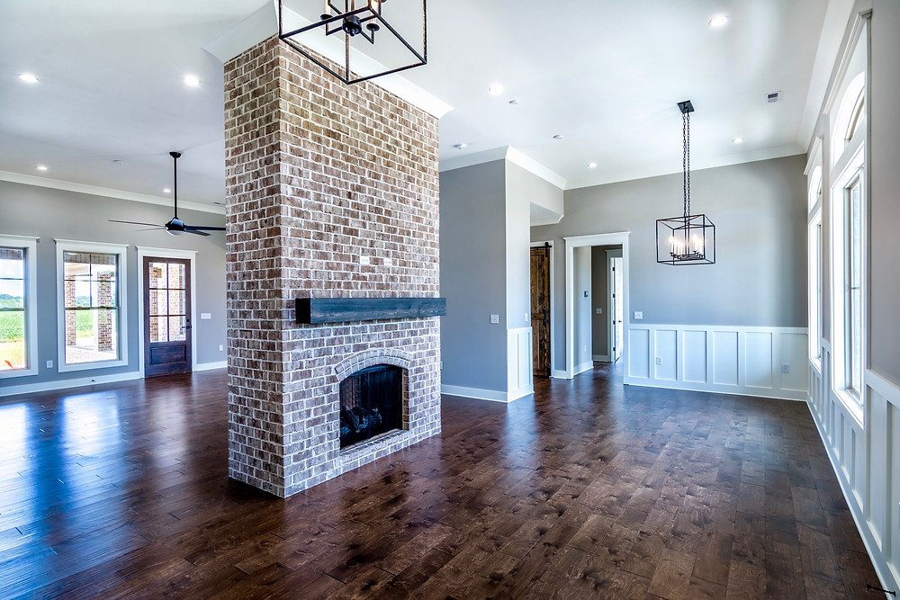 Dining and living room with wainscoting in this custom home in Muscle Shoals, AL