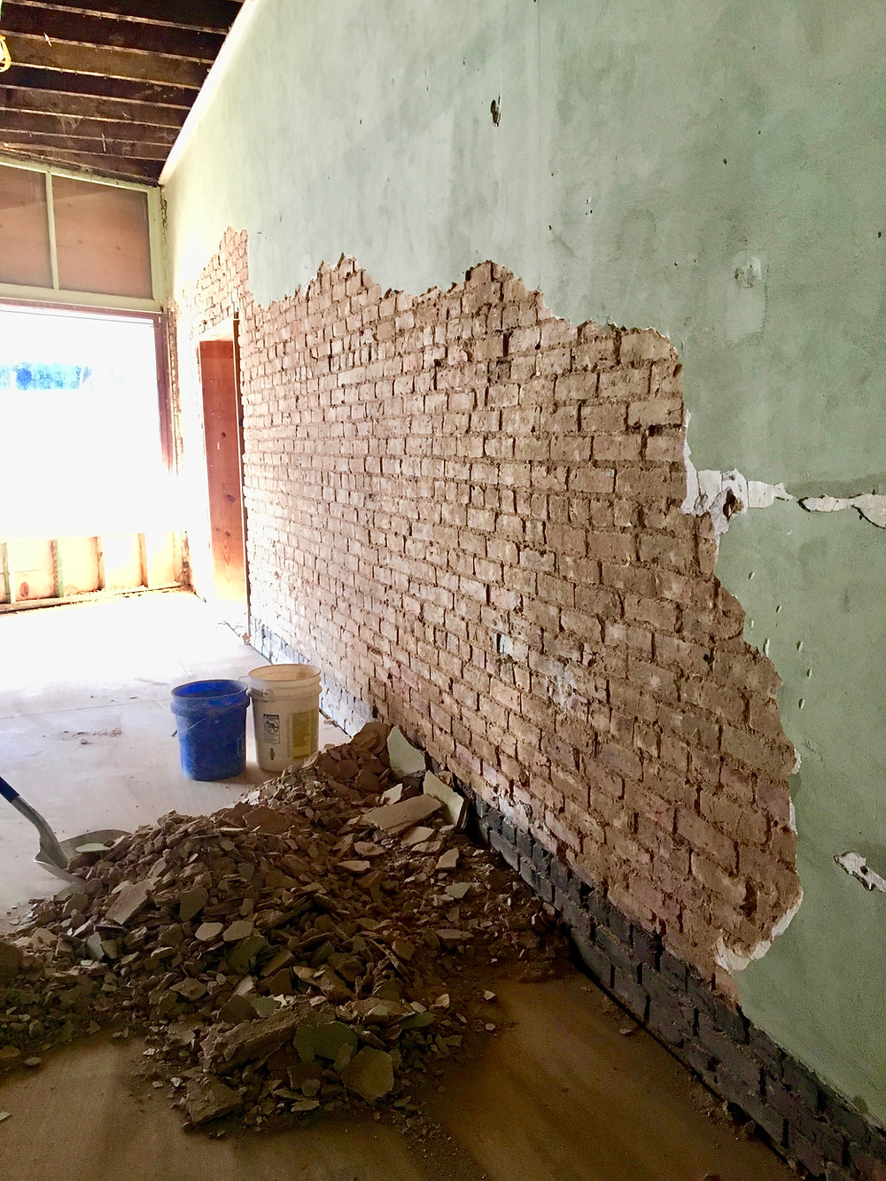 Brick underneath the plaster at the House of Vacuums, East Florence AL, Sweetwater District