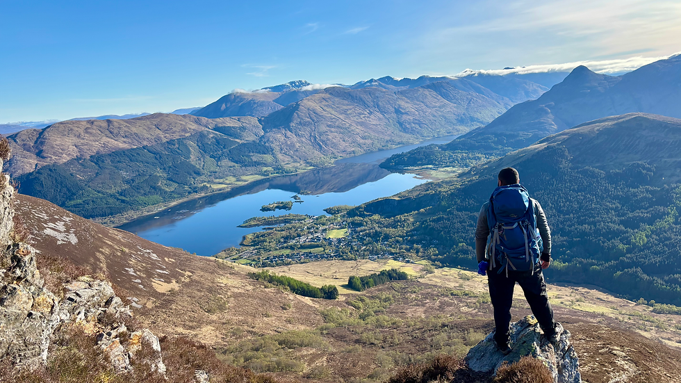 Abdulaziz enjoying stunning views over the loch on ascent of first Munro