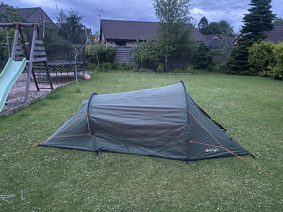 Practicing setting up tent in garden