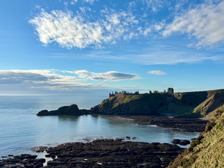 Dunottar Castle with blue sky and wisping clouds