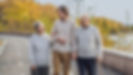 elderly-couple-walking-with-grandson.jpg