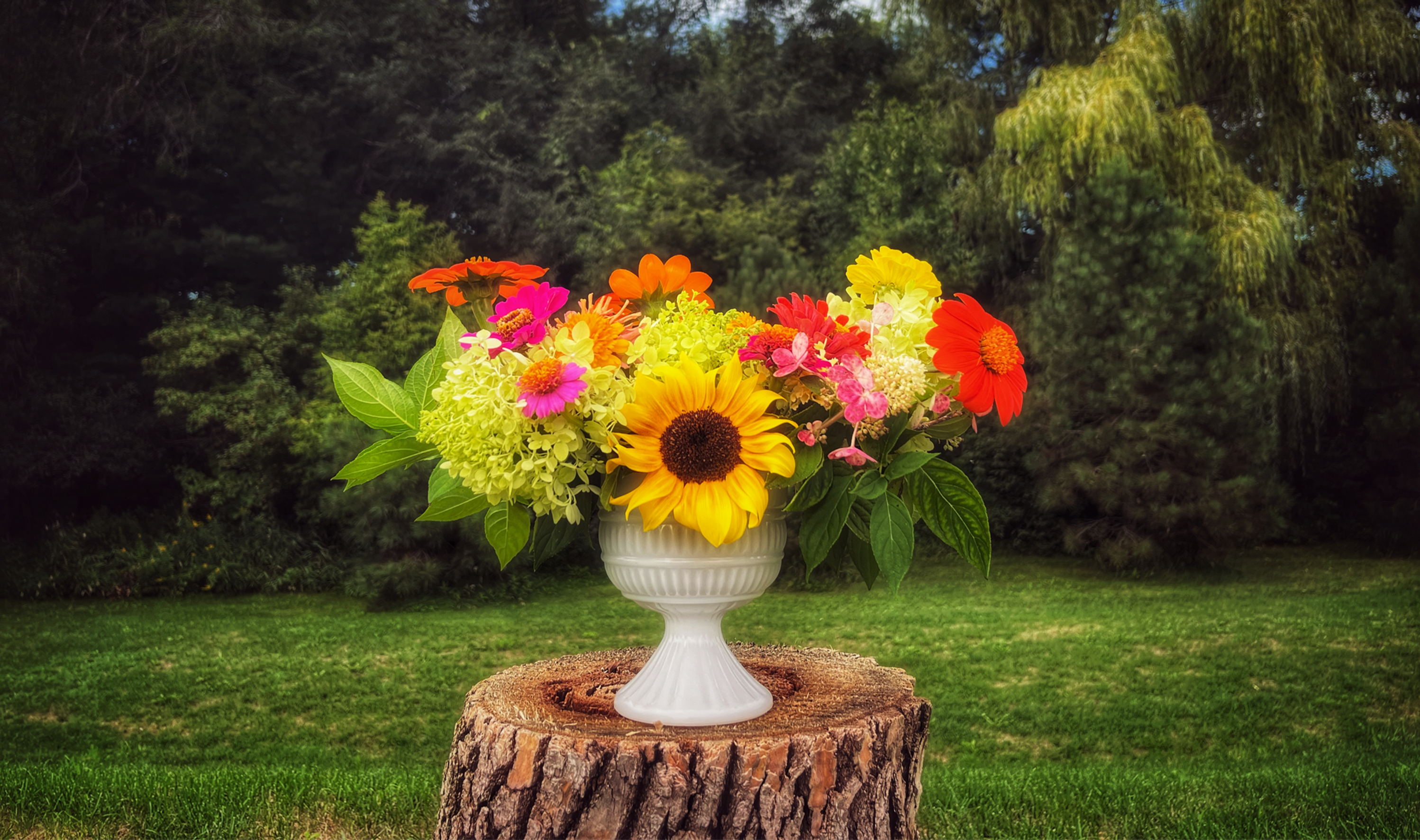 Bright arrangement featuring sunflowers, hydrangeas and other locally grown blooms