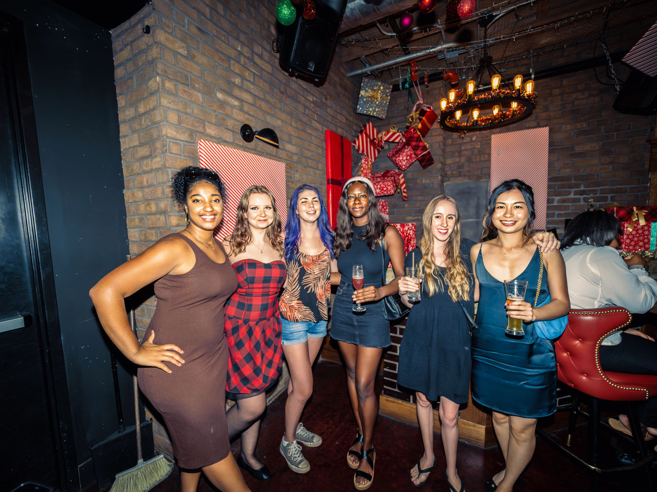 Group of friends enjoying a social night out together at a festive event.
