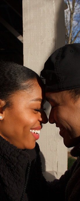 portrait of a biracial couple with their foreheards touching