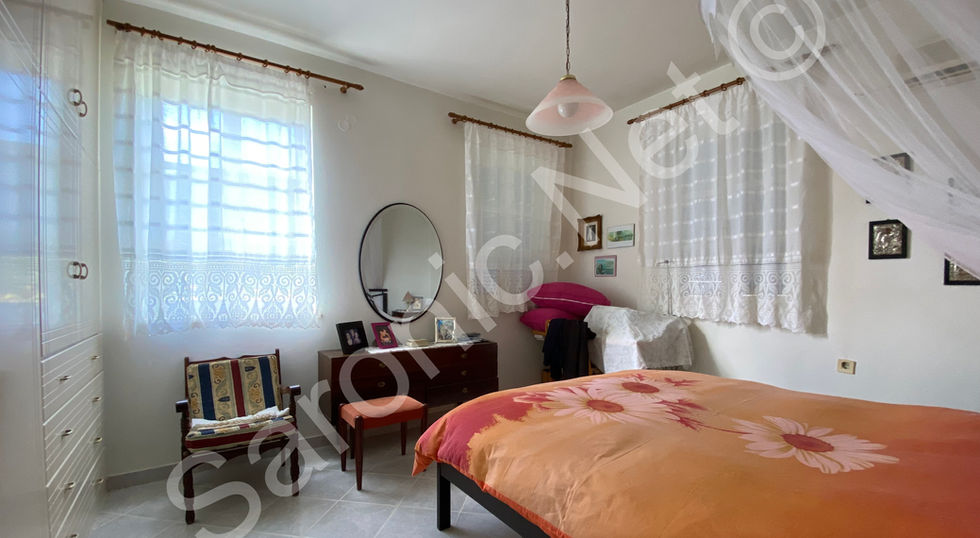 Bright and light Master bedroom with nicely tiled floor, 3 good sized windows and full length fitted wardrobes