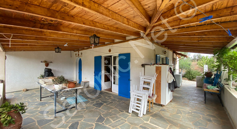 Rambling wrap around loggia with beautiful beamed roof and paved walkways