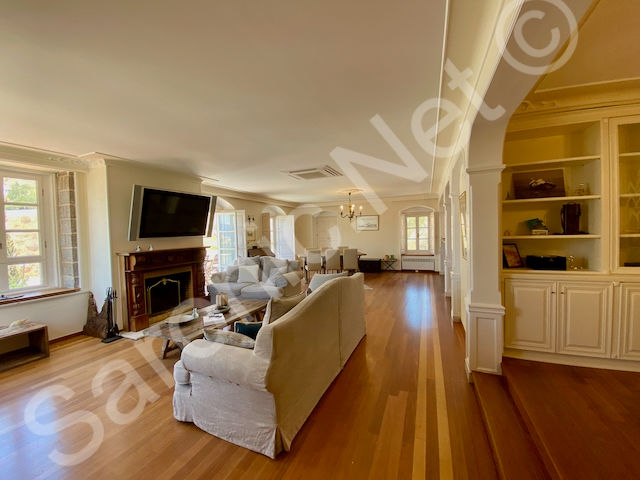 Pomegranate House For Sale Built in storage and bookcase cabinetry in the office area, fabulous focal fireplace and multiple windows allowing lots of light