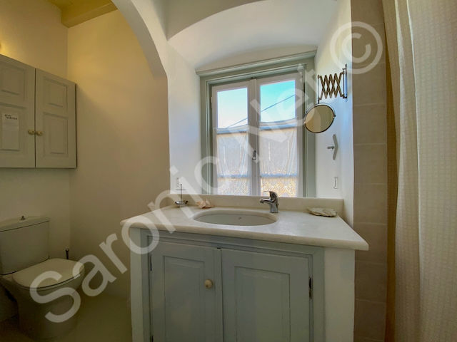 Giving an old world feel, the upper floor bathroom has a lovely marble surround ceramica sink unit with storage and wall cabinet