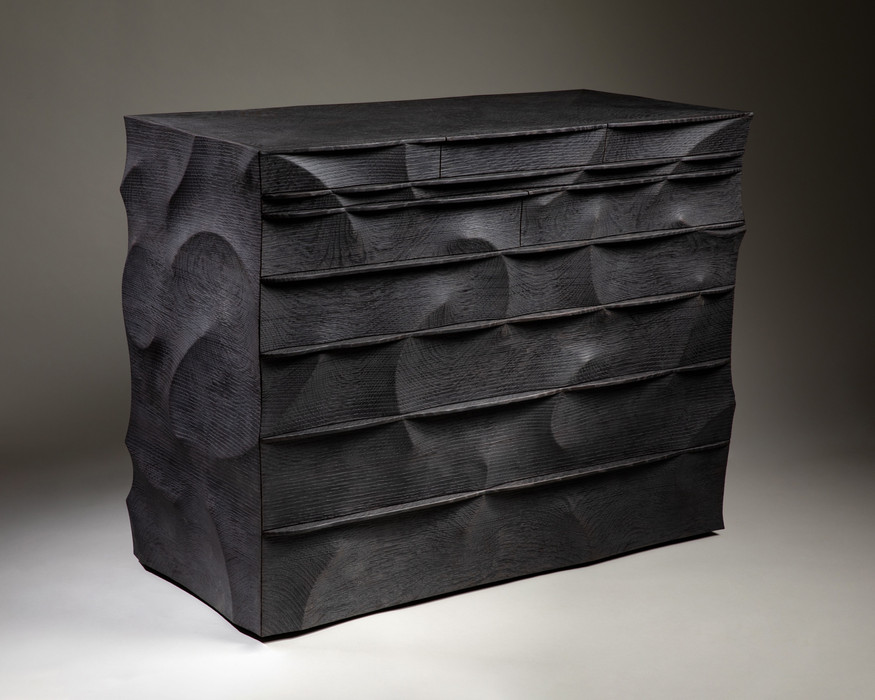 A chest of drawers in black scorched oak by John Makepeace