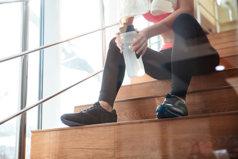Resting on the stairs after a workout